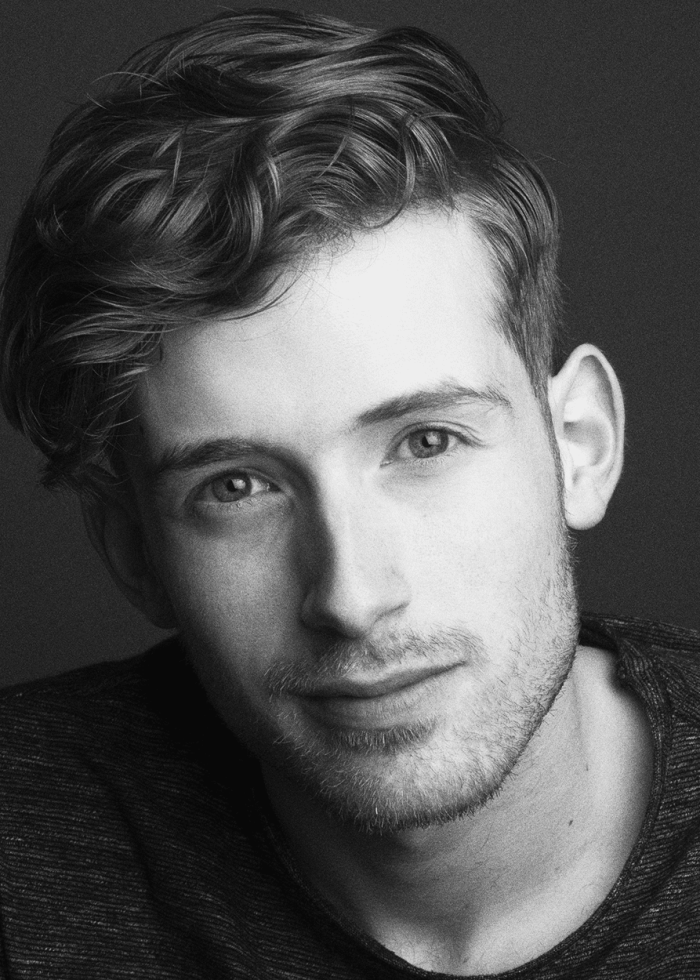 Black and white portrait of Daniel David Stewart, looking at the camera