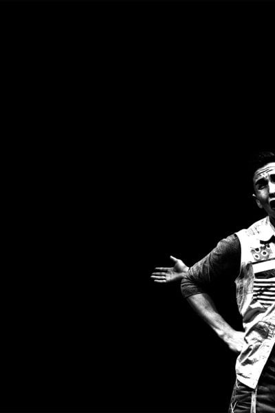 Two actors in a theatrical performance of "The Stinky Cheese Man," one with a distressed expression, the other holding a puppet.