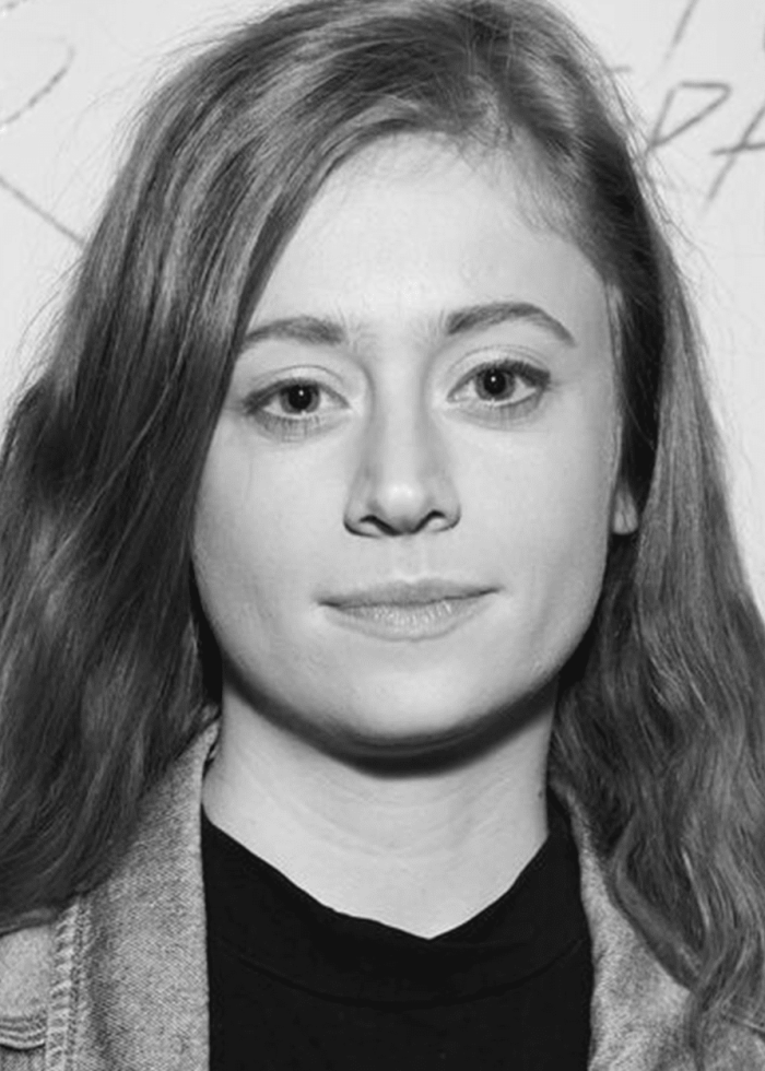 Susannah Perkins, looking directly at the camera in black and white