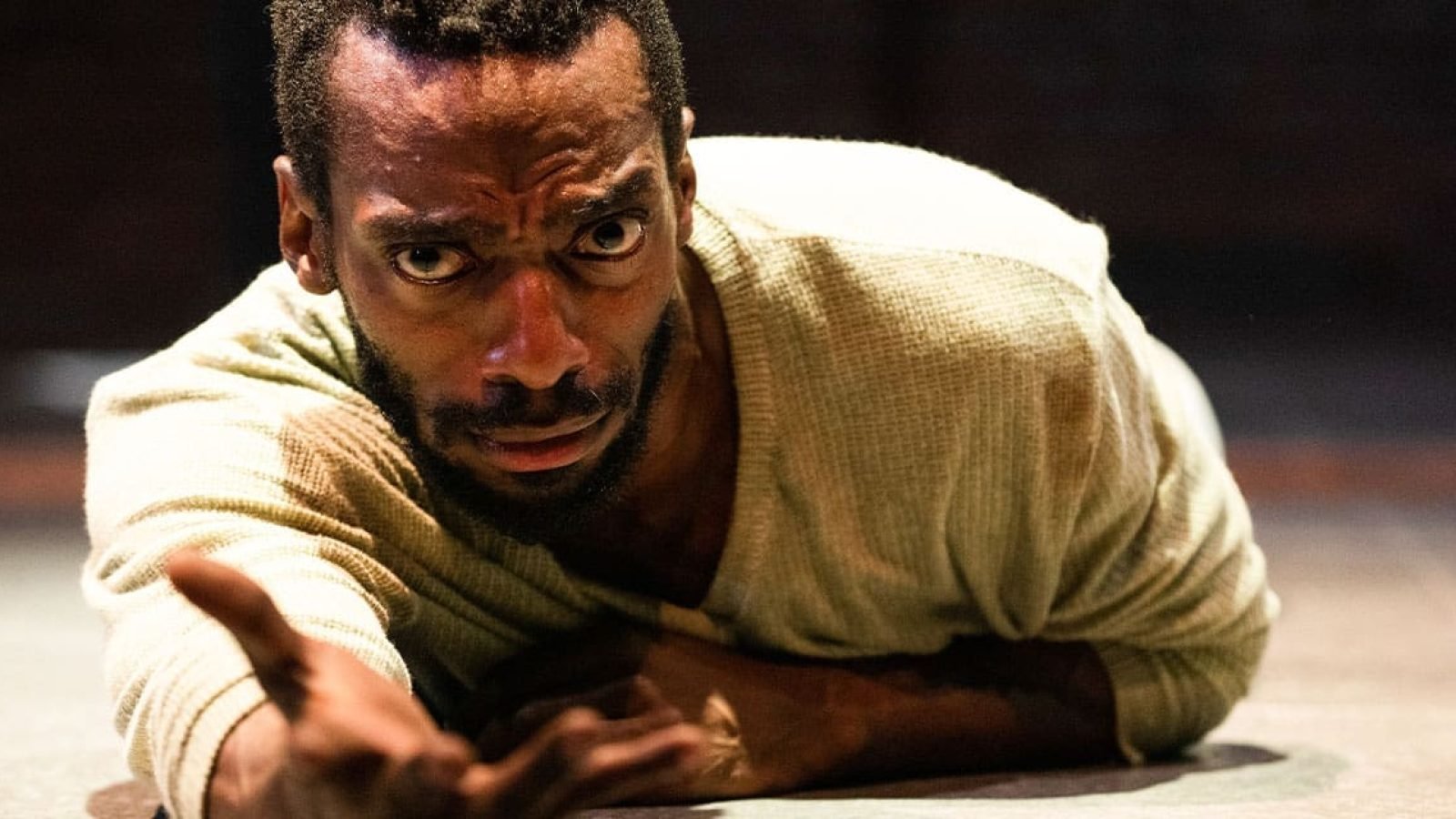 Man in anguish, reaching out; evocative of lost love and heartbreak.