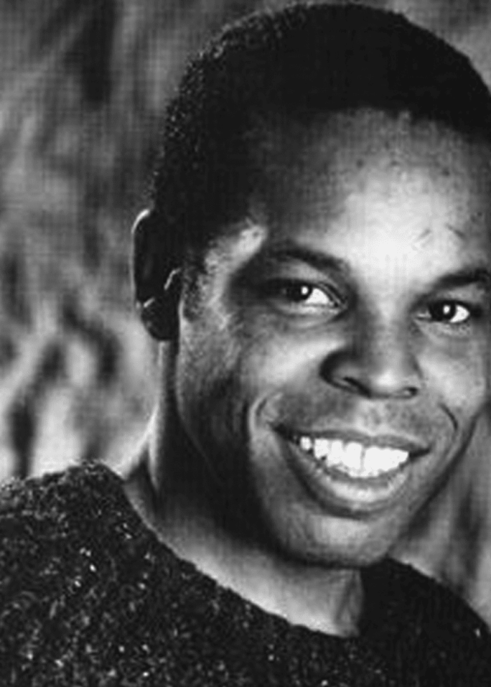 Thomas_RayAnthony Ray Anthony Thomas smiling in a black and white photo