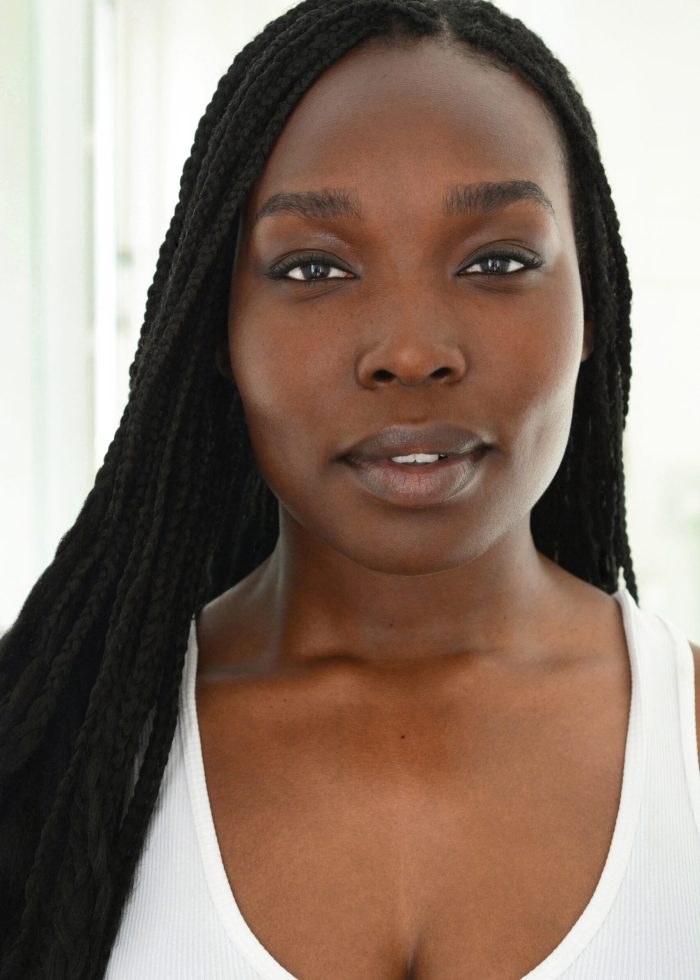 Veronica Otim (lady in orange) headshot