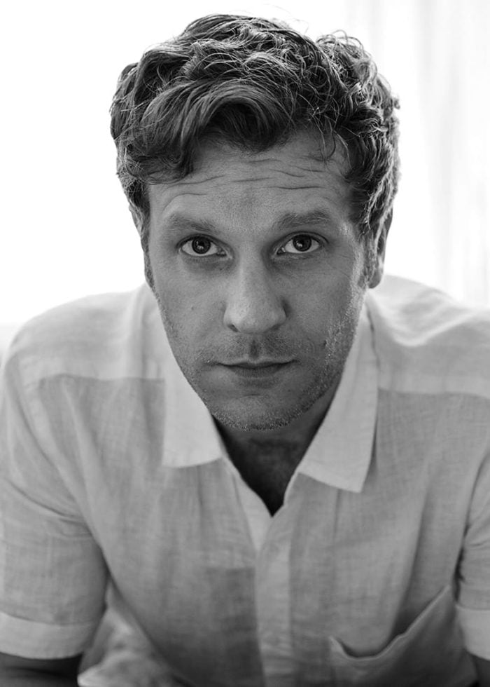 Vince Nappo portrait in a white shirt, looking directly at the camera.