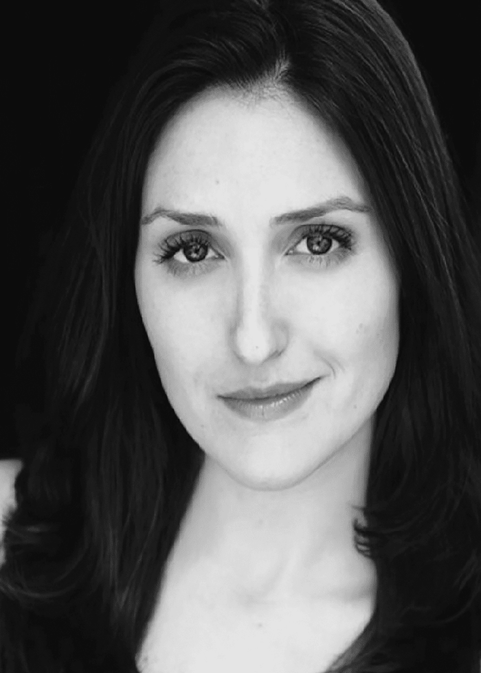 Headshot of Liz Wisan with dark hair, looking at the camera