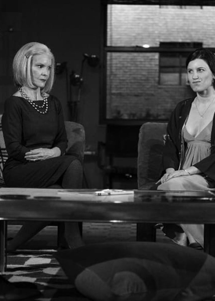 Two women in a living room; a scene from the play "Women or Nothing.