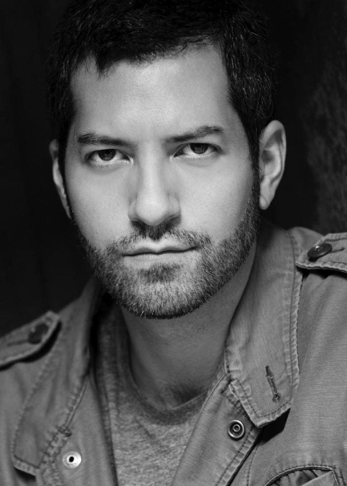 Alfredo Narciso, actor, looking at the camera with a serious expression.