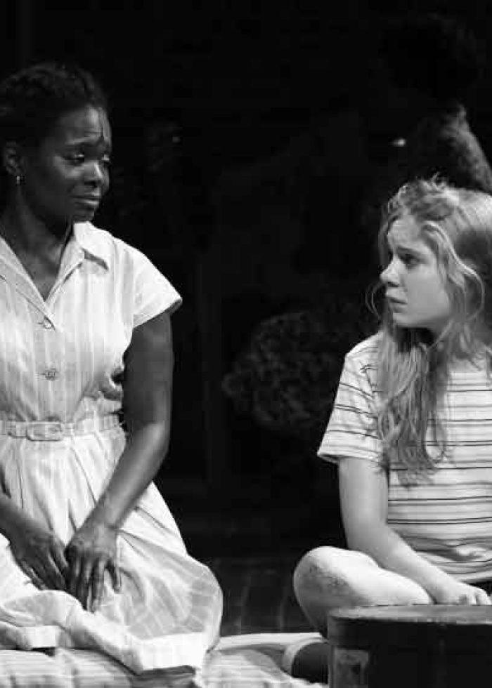 Two actresses from "The Secret Life of Bees" on stage, looking at each other