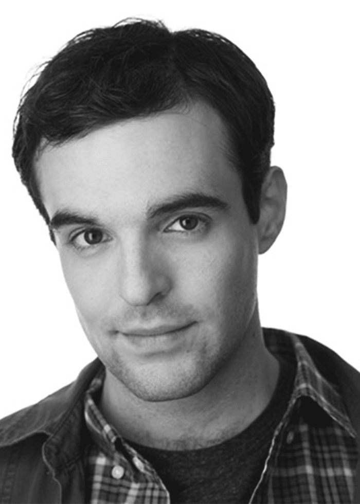 Ben Schrager, a man with dark hair, looks at the camera.