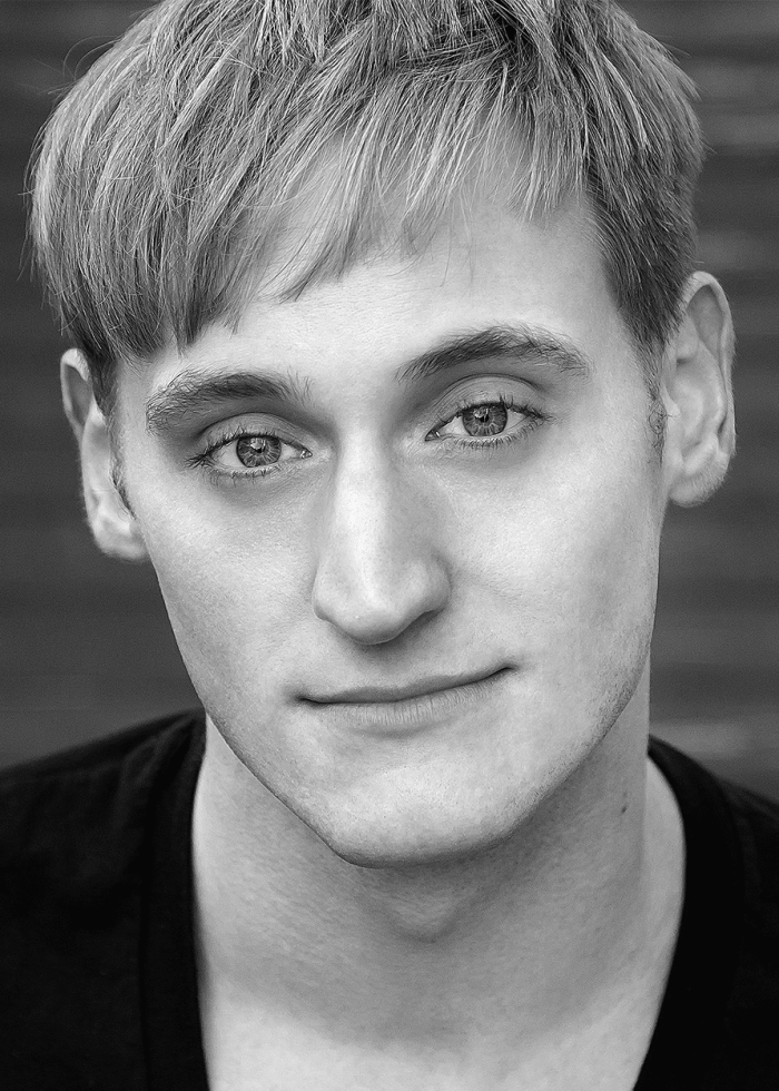 Close-up portrait of Nathaniel Dolquist, looking directly at the camera.
