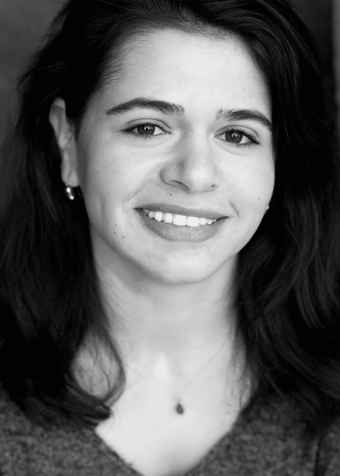 Estefanía Fadul smiling for a headshot, looking directly at the camera.