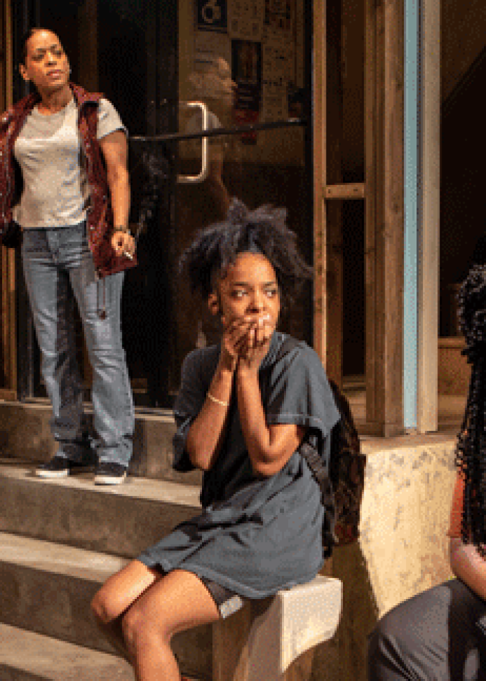 Cast of "Halfway Bitches" on a stoop; a New York theater production.