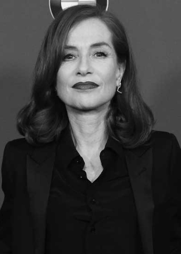 Isabelle Huppert at the DGA Awards, wearing a black outfit.