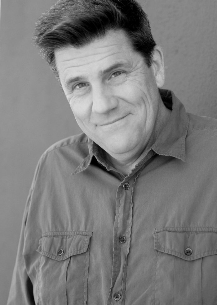 Rod McLachlan smiling in a button-up shirt