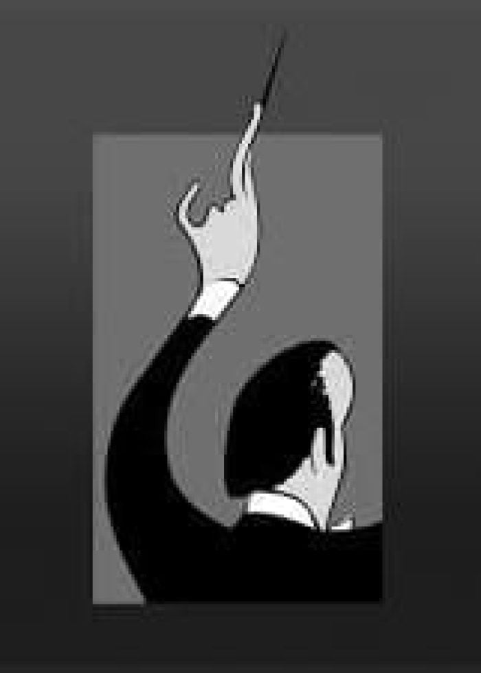 Conductor with baton, viewed from the back. Music Theatre International.