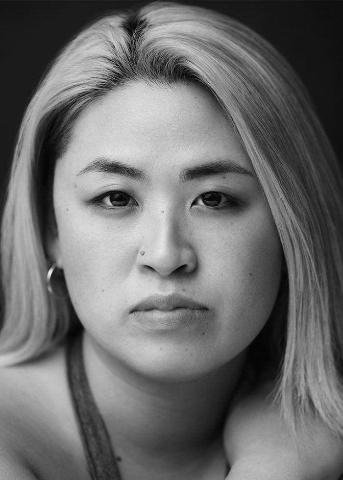 Close-up portrait of Sarah Shin, looking directly at the camera