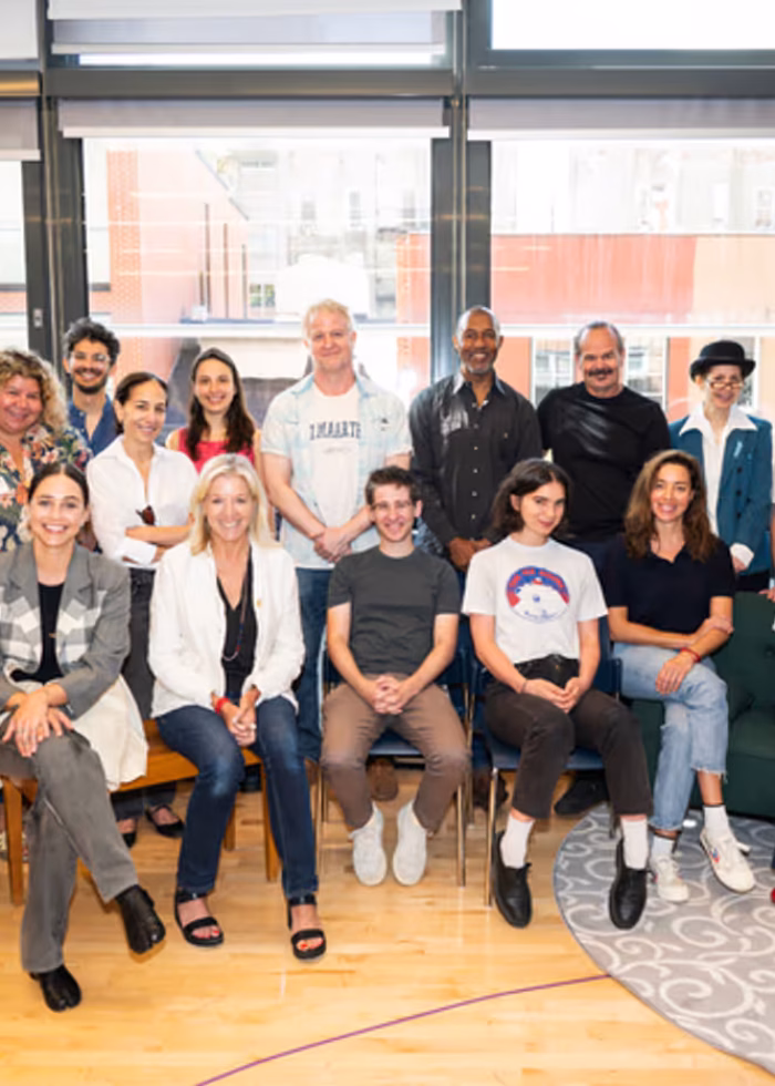 Cast and crew of Ethan Coen's 'Let's Love!' in rehearsal, posing for a group photo.