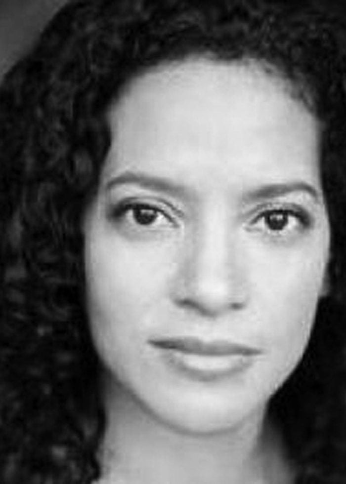 Zabryna Guevara, actress, looking at the camera with a serious expression.